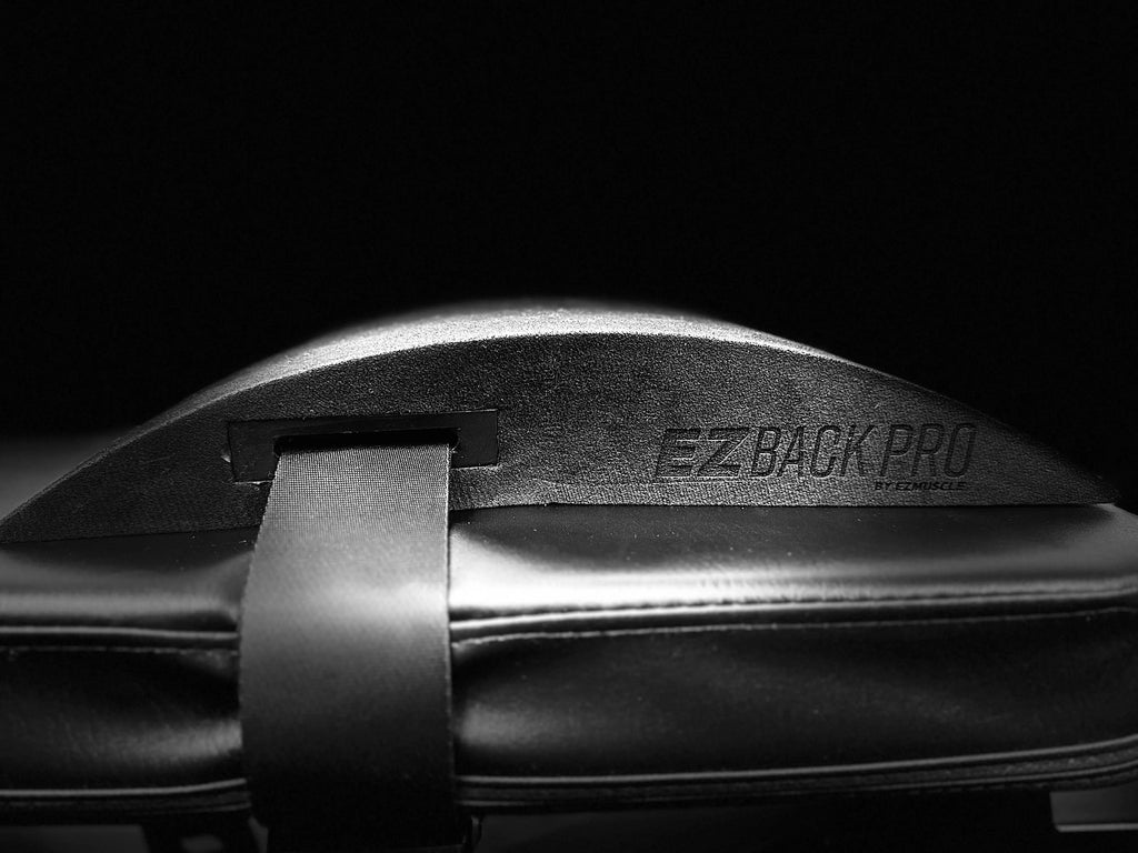 EZBack Pro Level 1 strap secured around a flat workout bench, demonstrating setup for posture support and back alignment during bench exercises.